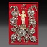 Untitled by An Ivory Debulto of the Niño Jesus in a lagang adorned shadow box, ivory and mother-of-pearl, sold Jan 2026