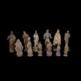 Untitled by A Group of Twelve Santos De bulto, size variable:<br> smallest:<br> H: 9 1/2” (24 cm)<br> L: 4” (10 cm)<br> W: 3” (8 cm)<br><br>, sold Jan 2026