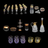 Untitled by A Thirty Seven Piece Set of Moser Crystalware, 6 Goblet: H: 9 1/4” (23 cm) x D: 4” (10 cm)<br /> 1 oval bowl: H: 9 1/4” (23 cm) x D: 10 1/2” (27 cm)<br /> 1 oval bowl:, sold Jan 2026