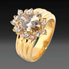 A Classic Oval Brown Diamond Ring, Untitled, Set in 18k yellow gold, the ring is centered by an oval brown diamond weighing approximately 2.00 cts, accented by a halo of round diamonds weighing approximately 0.40cts.<br /><br />Estimated color and clarity grade: Q-R Very Light Brown, VS clarity<br /><br />Weighs 11.10 grams.