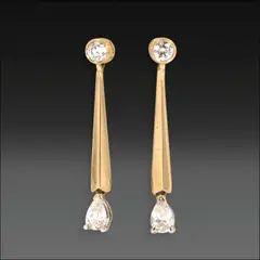 Untitled by 14k Dangling Earrings, Geometric and minimalist in design, these earrings feature pear-shaped diamonds totaling approximately 0.50 carats, susp, sold Oct 2025