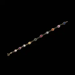 An 18k Bracelet, Untitled, The 18k yellow gold bracelet features oval shaped multi-colored stones.