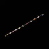 An 18k Bracelet, Untitled, The 18k yellow gold bracelet features oval shaped multi-colored stones.