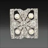 Untitled by An Art Deco Diamond and Pearl Brooch, An art deco brooch set with pearls, old-cut diamonds totaling to approximately 3.00 carat sand enhanced with milgrain de, sold Oct 2025