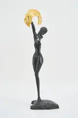 Daphne by Ernst Fuchs, 1973, Bronze, dunkelbraun patiniert, mit aufgesteckter Agraffe, vergoldet, sold Mar 2022