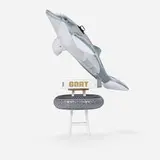 Jeff Koons, GOAT: A Tribute to Muhammad Ali (Champ's Edition), 2004, bound printed paper, inflatable PVC dolphin and tire, painted wood, maple, gelatin silver print
