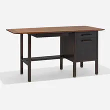 Desk by Edward Wormley, c. 1960, walnut, stained mahogany, brass, sold Feb 2024