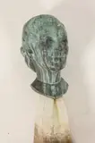 American School, mid 20th Century, Bronze female bust raised on marble column. - Height: 25 1/4" including column