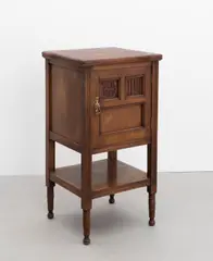 Aesthetic Movement, Bedside cupboard, circa 1880, Mahogany, single door with two decorative panels, supports united by an under tier