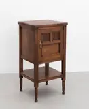 Aesthetic Movement, Bedside cupboard, circa 1880, Mahogany, single door with two decorative panels, supports united by an under tier