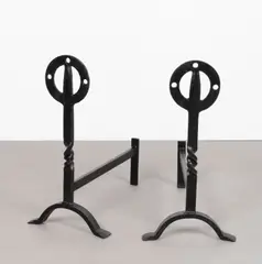 Glasgow School, Pair of firedogs, circa 1900, Iron, the upright with pierced roundels