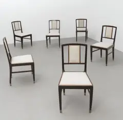 Vienna School, Set of six dining chairs, circa 1910, Stained wood, upholstery, brass sabots