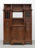 Vienna School, Seccessionist cabinet, circa 1900, Oak, glass and with a bevelled mirror, decorated with stylised arrow motifs in ivory, ebonised wood and pewter inlay
