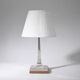 James Dixon and Sons, Table lamp of 'candlestick' form, first half 20th century, Electro-plated metal with faux riveted detail, oak base, fabric shade