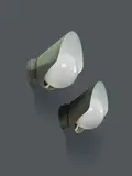 Paavo Tynell, Paire d'appliques mod. "7309", A pair of '7309' wall sconces in partially painted copper and opaline glass by Paavo Tynell designed circa 1940 and edited by Idman