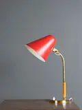 Paavo Tynell, Paire de lampes de table mod. "5233", A pair of '5233' table lamps in brass, painted metal and wood by Paavo Tynell designed circa 1950 and edited by Taito