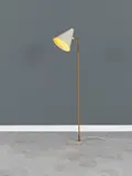 Paavo Tynell, Lampadaire mod. "9629/K10-10", A '9629/K10-10' floor lamp in brass, painted metal and rattan by Paavo Tynell designed circa 1950 and edited by Idman