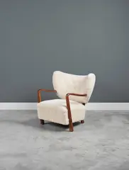 Hos Wulff, Fauteuil, An armchair in tinted beech and wool designed circa 1945 and edited by Hos Wulff