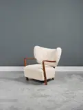 Hos Wulff, Fauteuil, An armchair in tinted beech and wool designed circa 1945 and edited by Hos Wulff