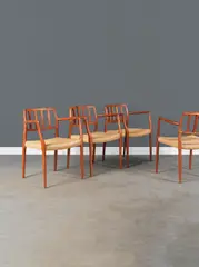 N.O. Møller, Ensemble de quatre fauteuils mod. "66", A set of four '66' armchairs in teak and rattan by N