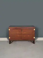 Cabinet by Svend Langkilde, A cabinet in Brazilian rosewood and brass by Svend Langkilde circa 1960 and edited by Langkilde Møbler, offered Nov 2023