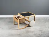 Alvar Aalto, Desserte roulante mod. "900", A '900' trolley by Alvar Aalto in birch, enameled ceramic, lacquered wood and cane designed in 1937 and edited by Artek circa 1965