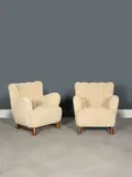 Travail Scandinave, Paire de fauteuils, A Scandinavian pair of wood and wool armchairs circa 1940-1950