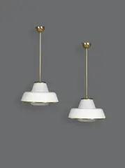 Paire de suspensions mod. "61-347" by Lisa Johansson-Pape, A pair of '61-347' ceiling lamps in brass, painted metal and opaline glass by Lisa Johansson-Pape and edited by Orno cir, offered Nov 2023