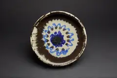 Plat by Jean Besnard, A signed plate in enamelled ceramic by Jean Besnard of 1925, sold May 2023