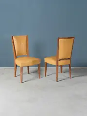 Deux chaises by Eugène Printz, Two chairs in mahogany wood and leather by Eugène Printz for the decoration of a private house designed in 1946, sold May 2023