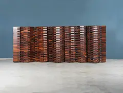 Poggi Editeur, Paravent, A rosewood and brass folding screen by Poggi Editeur  circa 1960-1970