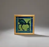 William De Morgan, 'Comic ostrich' tile, circa 1890, Earthenware, blue glaze on a celadon ground