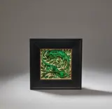 'Chameleons' tile by William De Morgan, circa 1890, Ceramic, decorated in shades of green and brown with two lizards amidst foliage, glazed, sold Dec 2023
