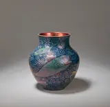 'Sunset and Moonlight' baluster vase by William De Morgan, 1895, Earthenware, triple-lustre glaze, decorated with swimming fish with red fins and lips, against a swirling sea background, sold Dec 2023