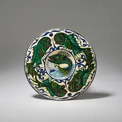 Bushey Heath Pottery, Small fish dish, 1922-32, Earthenware, polychrome glazes, decorated to the central well with a sunrise/sunset and a leaping fish