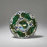 Bushey Heath Pottery, Small fish dish, 1922-32, Earthenware, polychrome glazes, decorated to the central well with a sunrise/sunset and a leaping fish