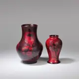 William Moorcroft, Two flambé vases, circa 1930, Flambé glazed earthenware, tube-lined decoration, in the 'Cornflower' and 'Big Poppy' patterns