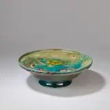 William Moorcroft, Large 'Fish' footed bowl, circa 1930, Flambé glazed earthenware, tube-lined decoration to the interior with six fish and four jellyfish amongst seaweed