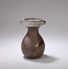 Untitled by Janet Leach, Stoneware, dark brown body, mottled blue-green glaze to neck and tenmoku glaze splash, sold Dec 2023