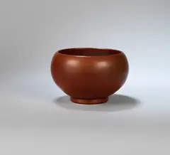 Bowl by Charles Vyse, circa 1940, Stoneware, matt red-brown glaze with yellow-green hues, Chinese Junyao bubble form, sold Dec 2023