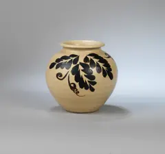 Vase by Charles Vyse, 1931, Stoneware, cream glaze with iron painted leaf motif, sold Dec 2023