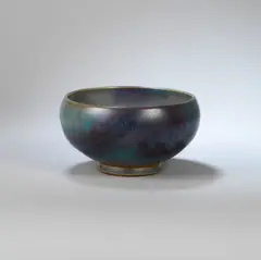 Bowl by Charles Vyse, circa 1940, Stoneware, blue and purple lustre 'Chun type' glaze, Chinese Junyao bubble form, sold Dec 2023