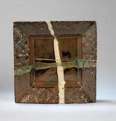 Shoji Hamada, Square dish, Stoneware, mottled brown glaze with poured cream and green cross, and raised cross hatch pattern to rim