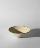 Conical bowl by Lucie Rie, circa 1968, Stoneware, mixed clays producing an integral spiral, offered Oct 2023