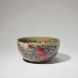 'Spanish' bowl by William Moorcroft, circa 1918, Glazed earthenware, painted with a flower head pattern on a mottled green and blue ground, sold Jun 2023