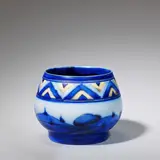 'Dawn' vase by William Moorcroft, circa 1925, Glazed earthenware, of squat and footed form, painted with  a tube-lined landscape and geometric border in blue and yell, offered Jun 2023