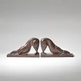 H. Rical, Pair of Art Deco 'dog' bookends, circa 1930, Patinated bronze, each cast from a model as a stretching 'Borzoi' hound, integral bronze base
