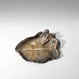 Maurice Bouval, Art Nouveau Vide poches, circa 1900, Patinated bronze, cast from a model with a naked woman reclining on a leaf