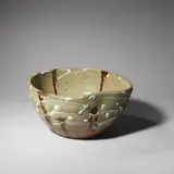 Takeshi Yasuda, Bowl, 1984, Stoneware, trailed white splashes beneath a green ash glaze, running iron splashes, squeezed indent to one side