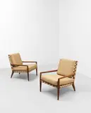 Untitled by T. H. Robsjohn-Gibbings, Walnut, fabric webbing, brass nail heads, sold Apr 2023
